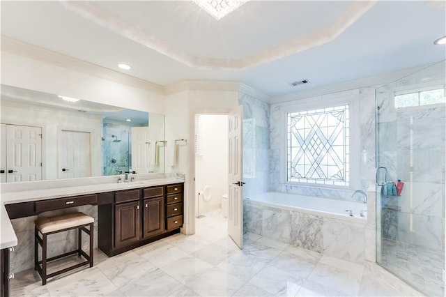 bathroom featuring a raised ceiling, crown molding, vanity, and independent shower and bath