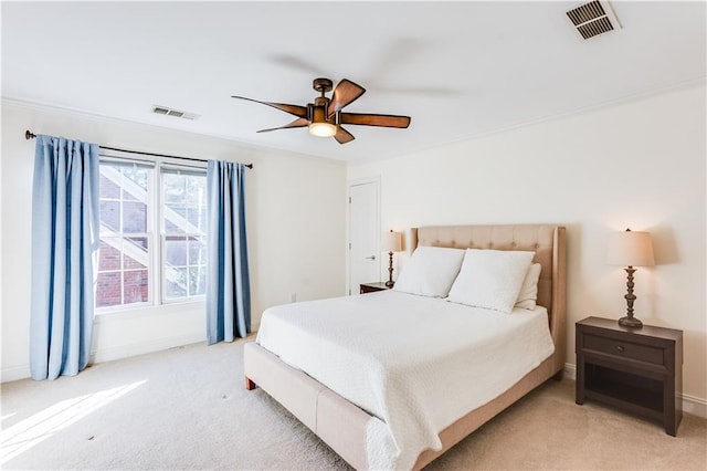 bedroom with light colored carpet and ceiling fan