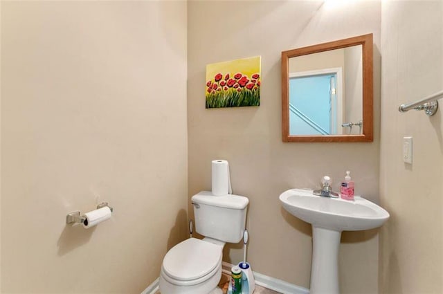 bathroom featuring toilet