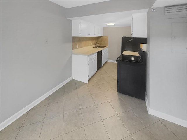 kitchen featuring white cabinets, exhaust hood, light tile patterned flooring, black appliances, and sink