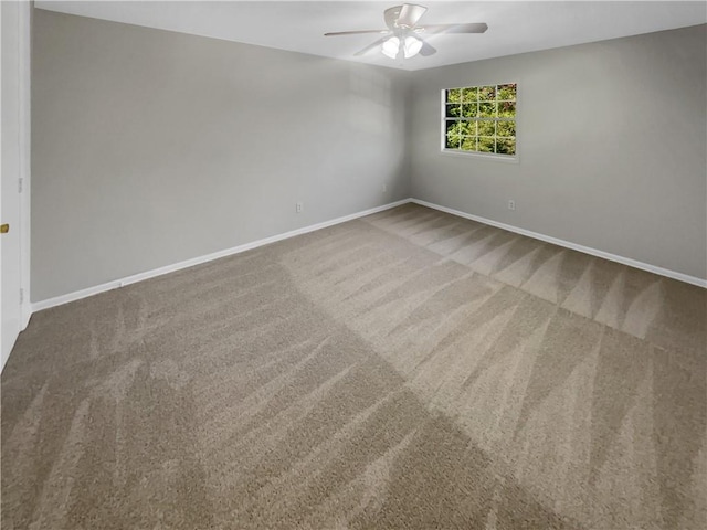 spare room with carpet flooring and ceiling fan