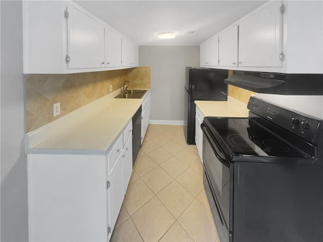 kitchen with black appliances, sink, white cabinets, decorative backsplash, and light tile patterned floors