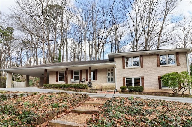 split level home with a carport and a porch