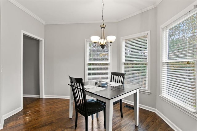 dining room featuring an inviting chandelier, ornamental molding, and dark wood-type flooring