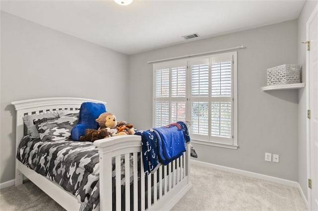 carpeted bedroom featuring multiple windows