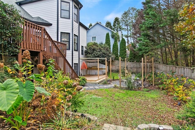 view of yard featuring a wooden deck