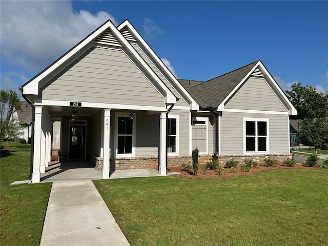 241 Saratoga Dr, Acworth, GA 30102 - view of front facade featuring a front yard and brick siding