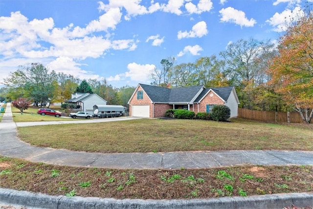 view of front of property featuring a front yard and a garage