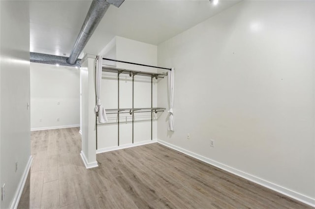 basement featuring light wood-type flooring