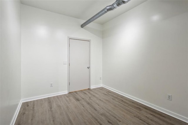 spare room featuring hardwood / wood-style floors