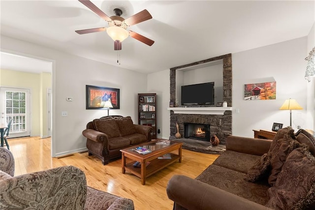 127 Walkabout Way, Dahlonega, GA 30533 - living area with a ceiling fan, light wood-type flooring, and a fireplace