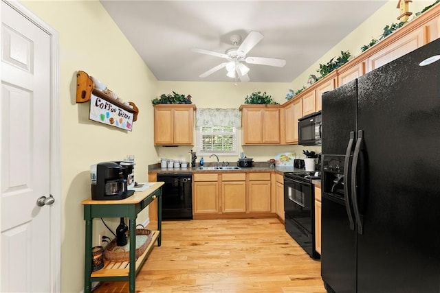 127 Walkabout Way, Dahlonega, GA 30533 - kitchen with black appliances, light brown cabinets, light wood finished floors, ceiling fan, and dark countertops