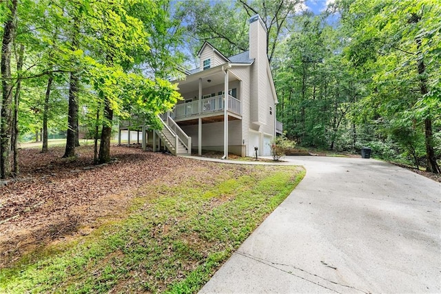127 Walkabout Way, Dahlonega, GA 30533 - rear view of house with stairs, driveway, a chimney, and a porch