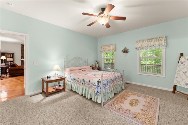 127 Walkabout Way, Dahlonega, GA 30533 - carpeted bedroom with baseboards and ceiling fan