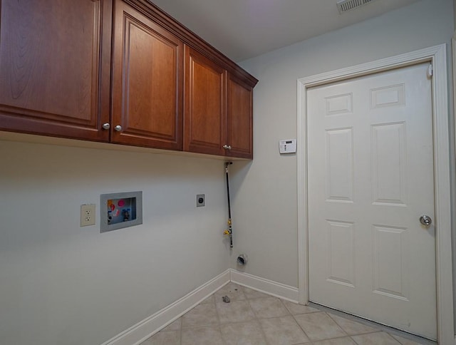 laundry room featuring hookup for an electric dryer, hookup for a gas dryer, cabinets, and hookup for a washing machine