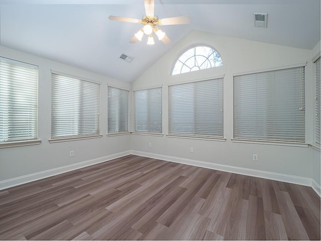 unfurnished sunroom featuring ceiling fan and vaulted ceiling