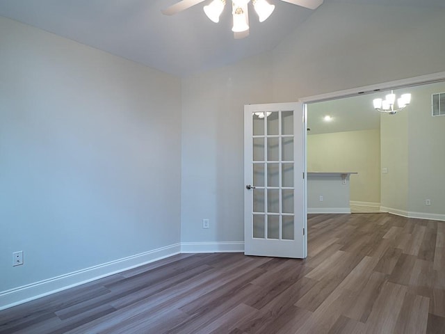 spare room with lofted ceiling, ceiling fan, and dark wood-type flooring