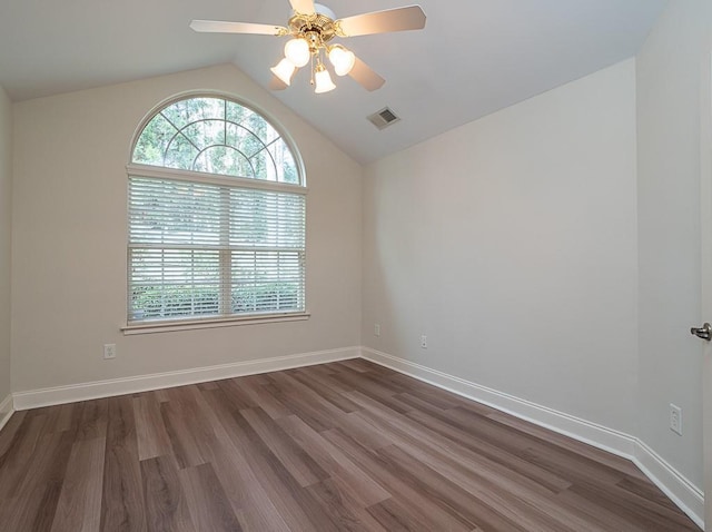 unfurnished room featuring vaulted ceiling, ceiling fan, and dark wood-type flooring