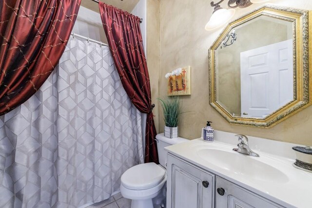 full bathroom featuring toilet, vanity, and a shower with shower curtain