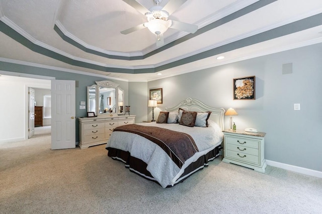 bedroom with light colored carpet, baseboards, a raised ceiling, ornamental molding, and ceiling fan