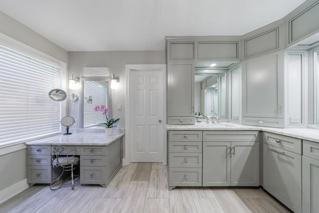 bathroom with vanity and baseboards