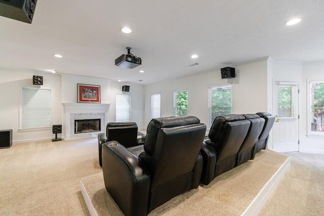 cinema with light colored carpet, recessed lighting, a high end fireplace, and baseboards