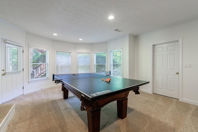 game room with light carpet, healthy amount of natural light, ornamental molding, recessed lighting, and baseboards