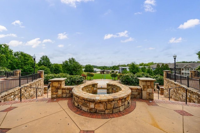 view of patio / terrace featuring fence