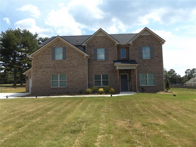 view of front of home featuring a front yard