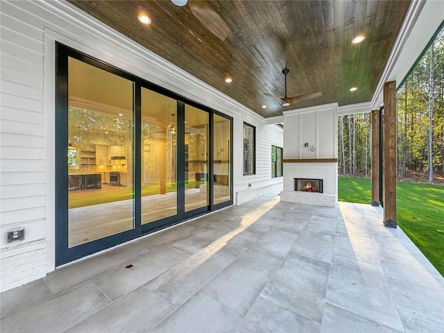 view of patio featuring ceiling fan