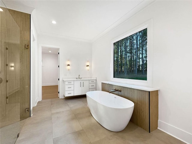 bathroom featuring ornamental molding, vanity, and plus walk in shower