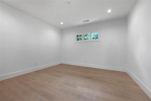 spare room with light wood-type flooring