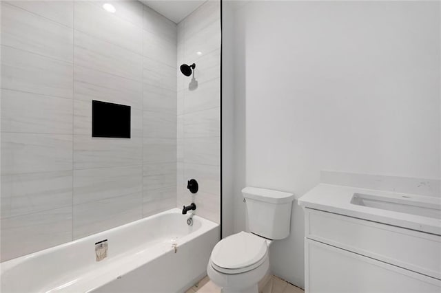 full bathroom with tiled shower / bath combo, vanity, and toilet