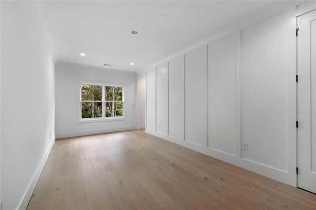 spare room featuring light wood-type flooring