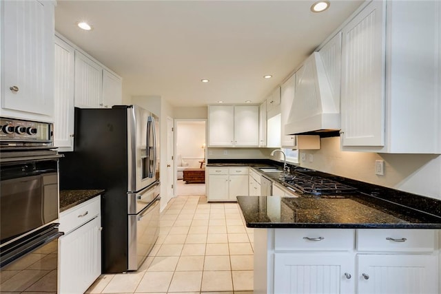 kitchen featuring recessed lighting, white cabinetry, a sink, and black appliances