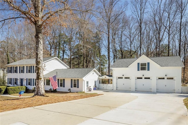 colonial house with concrete driveway