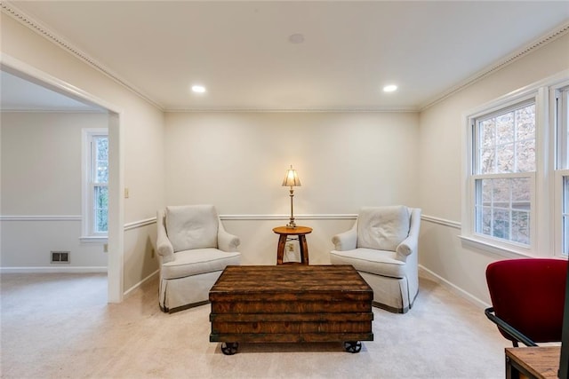 living area featuring recessed lighting, light carpet, visible vents, baseboards, and crown molding