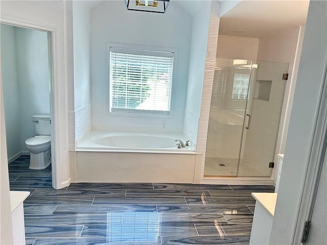 540 Langley Creek Dr, Loganville, GA 30052 - bathroom featuring vanity, a bath, and a shower stall