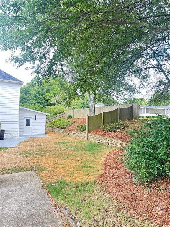 540 Langley Creek Dr, Loganville, GA 30052 - view of yard featuring a patio area