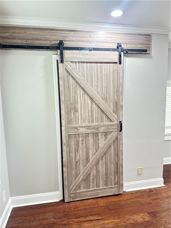 540 Langley Creek Dr, Loganville, GA 30052 - detailed view of a barn door, wood finished floors, and recessed lighting