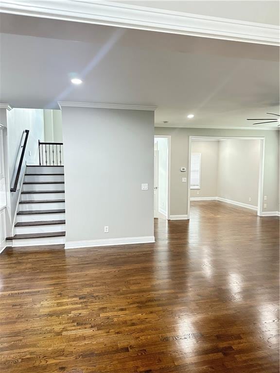 540 Langley Creek Dr, Loganville, GA 30052 - unfurnished living room featuring stairs, crown molding, dark wood-style flooring, recessed lighting, and ceiling fan