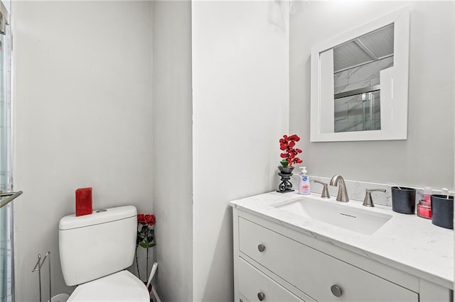 bathroom with vanity and toilet