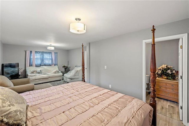 bedroom featuring light wood-style floors