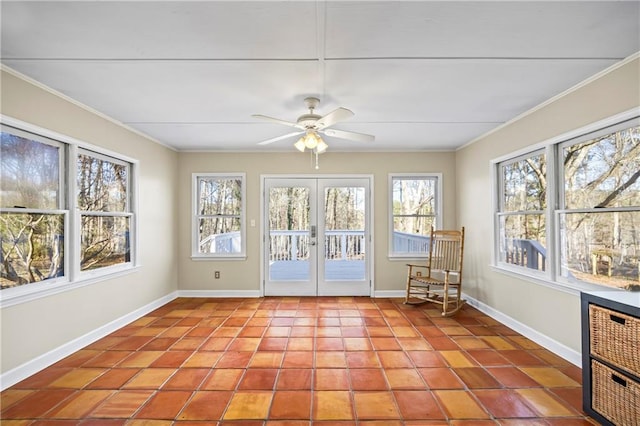 unfurnished sunroom featuring french doors and a ceiling fan