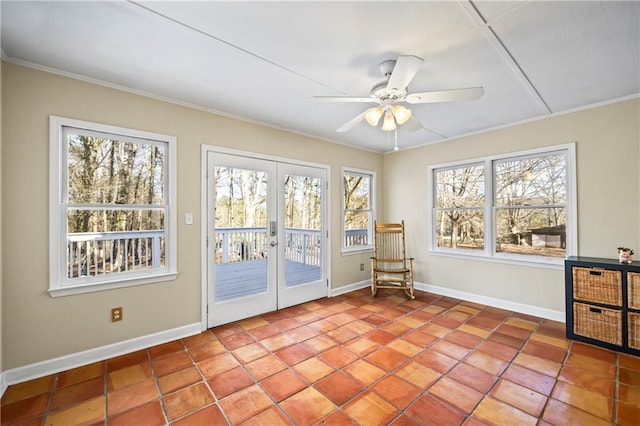 unfurnished sunroom featuring french doors and ceiling fan