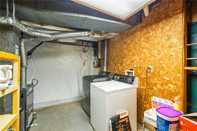 clothes washing area with washing machine and dryer and laundry area