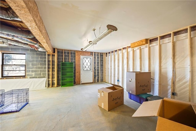 basement featuring concrete block wall