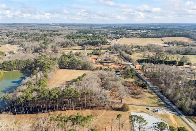 aerial view with a water view and a rural view