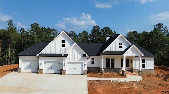 1010 Cable Rd, Waleska, GA 30183 - modern farmhouse style home with board and batten siding, driveway, a porch, and a shingled roof