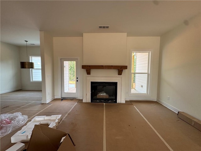 1010 Cable Rd, Waleska, GA 30183 - living room featuring plenty of natural light, baseboards, and a glass covered fireplace